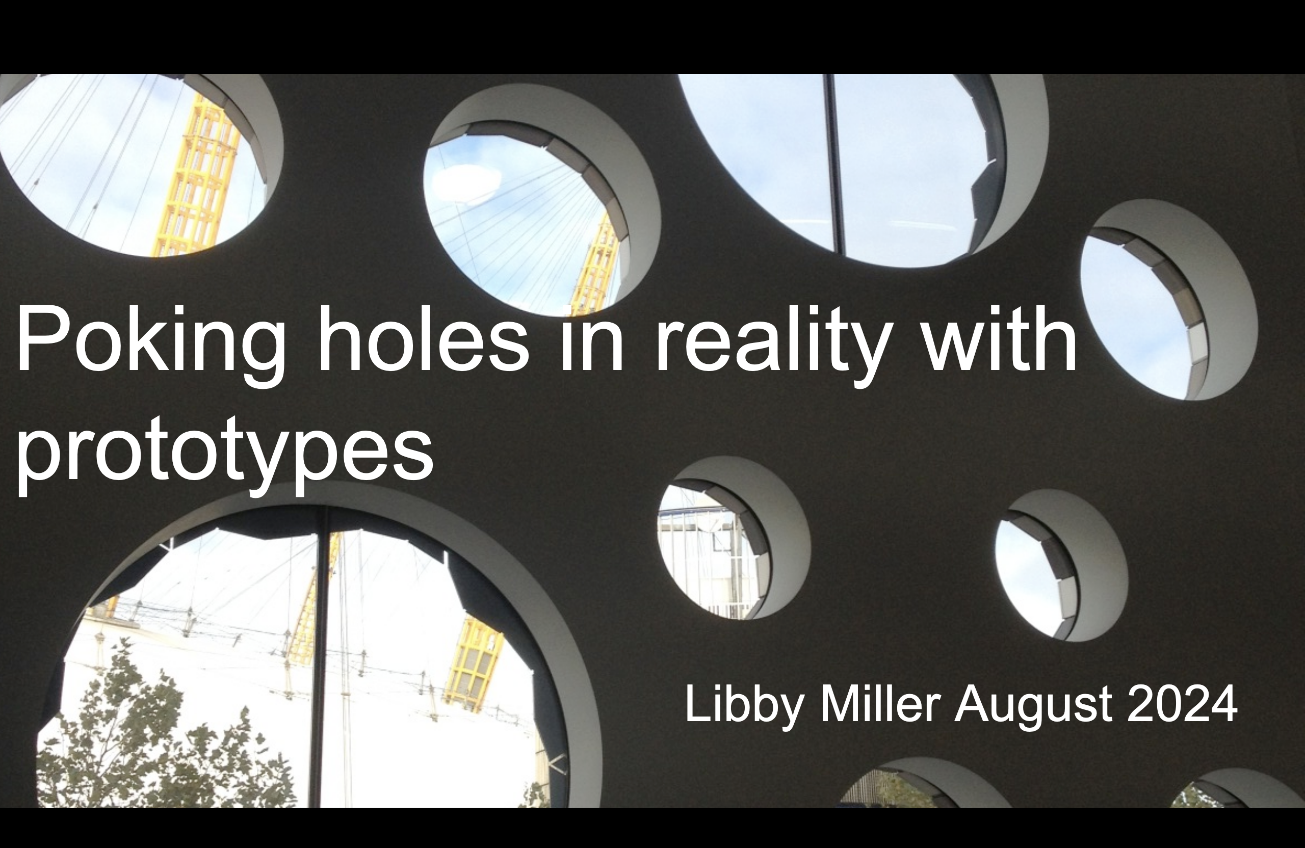 The title slide showing circular windows in ravensbourne college glimpsing views of the Dome behind it