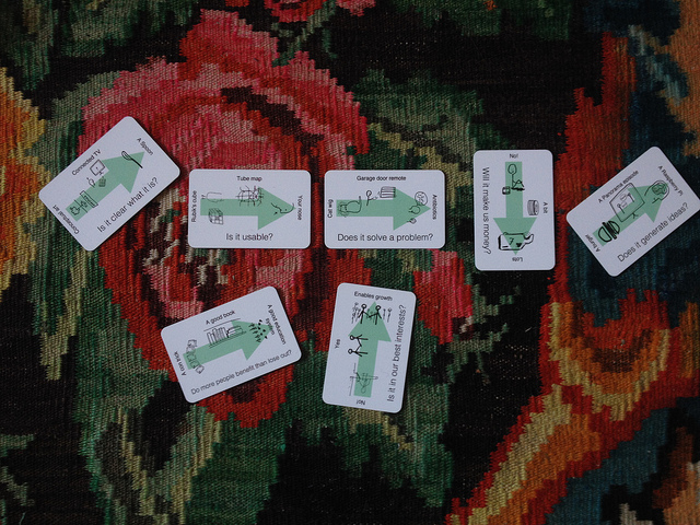 A selection of catwigs cards arranged on a multi-coloured carpet