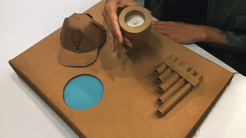 Animated gif showing various cardboard prototypes of radios and TVs
