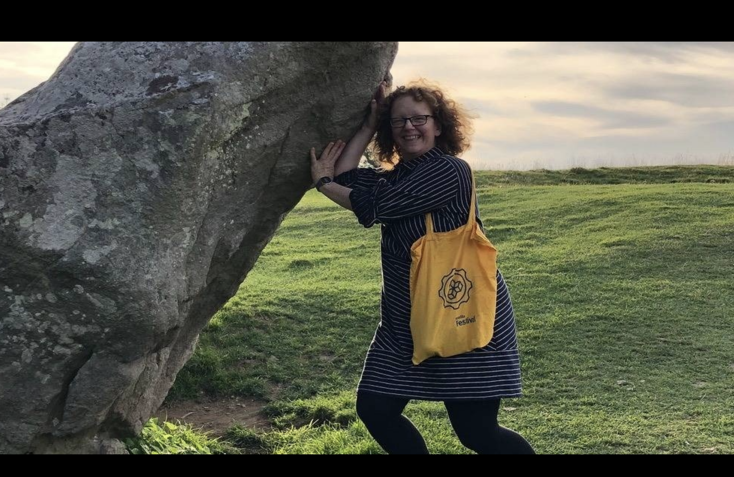 A more recent picture of Libby pretending to hold up a massive rock at Avebury