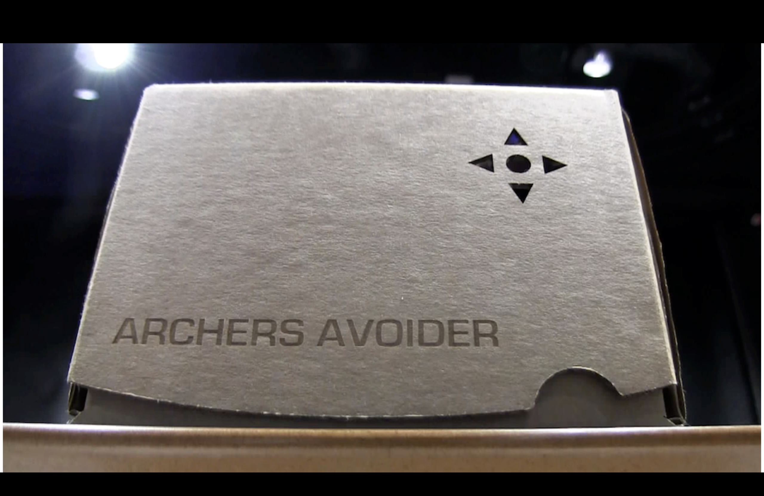 A cardboard box inscribed with 'archers avoider'
