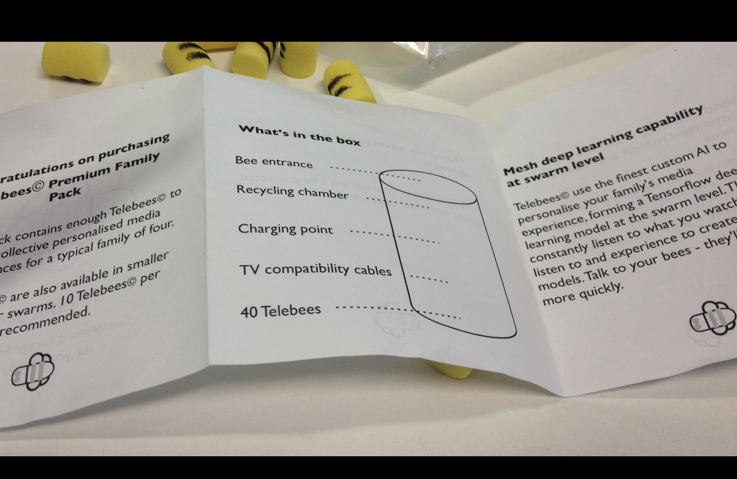 A picture of some yellow earplugs decorated to look like bees and some instructions about how to use your new tellebees